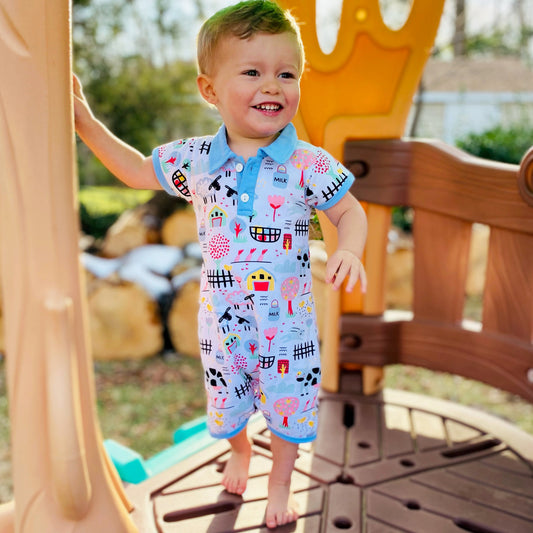 AnnLoren Boys One Piece Short Sleeve Romper. Fun Farm Animal Print with blue collar and 2 buttons in front. Snaps at inseam for easy changin